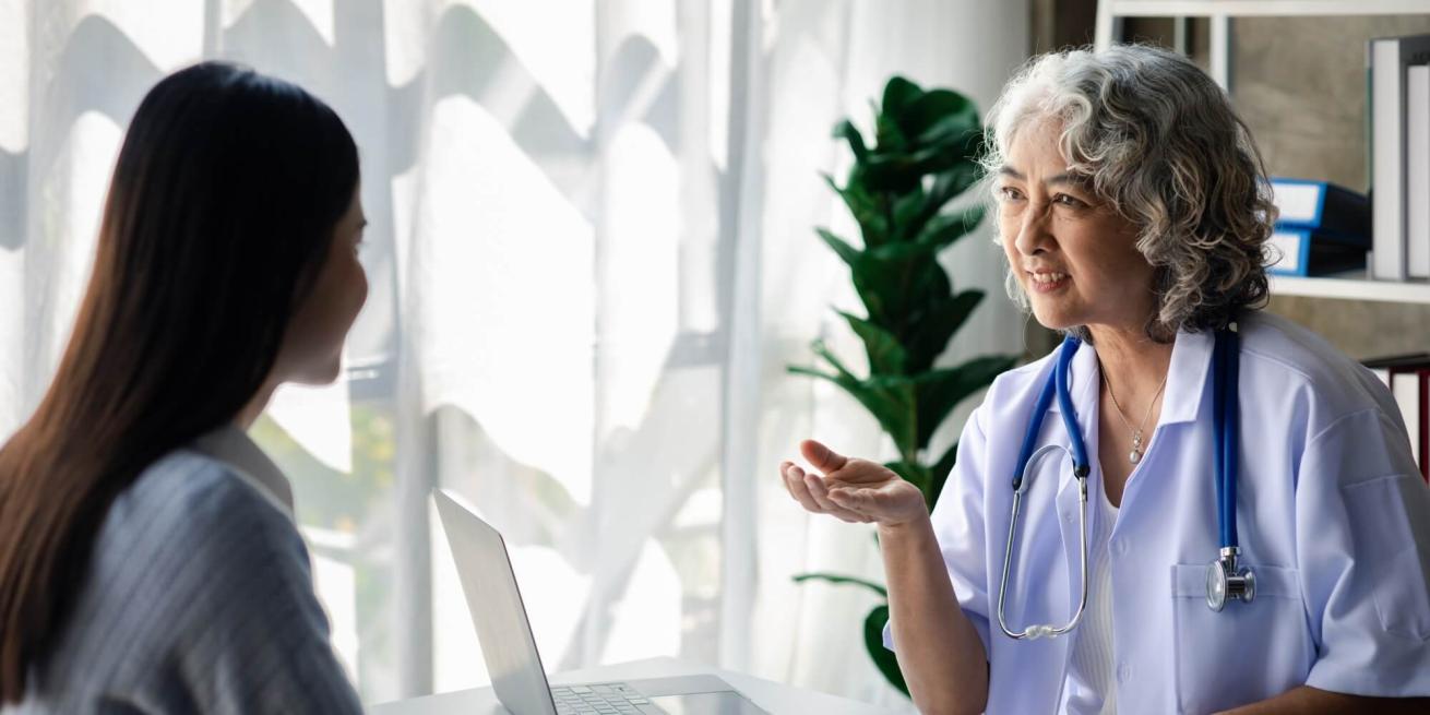 Veterinarian providing feedback to colleague